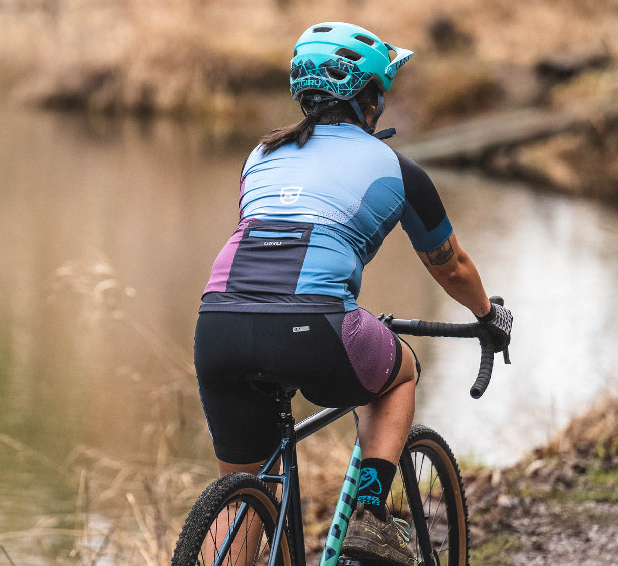 Close-up of women's padded cycling shorts showing leg grippers and reflective logos