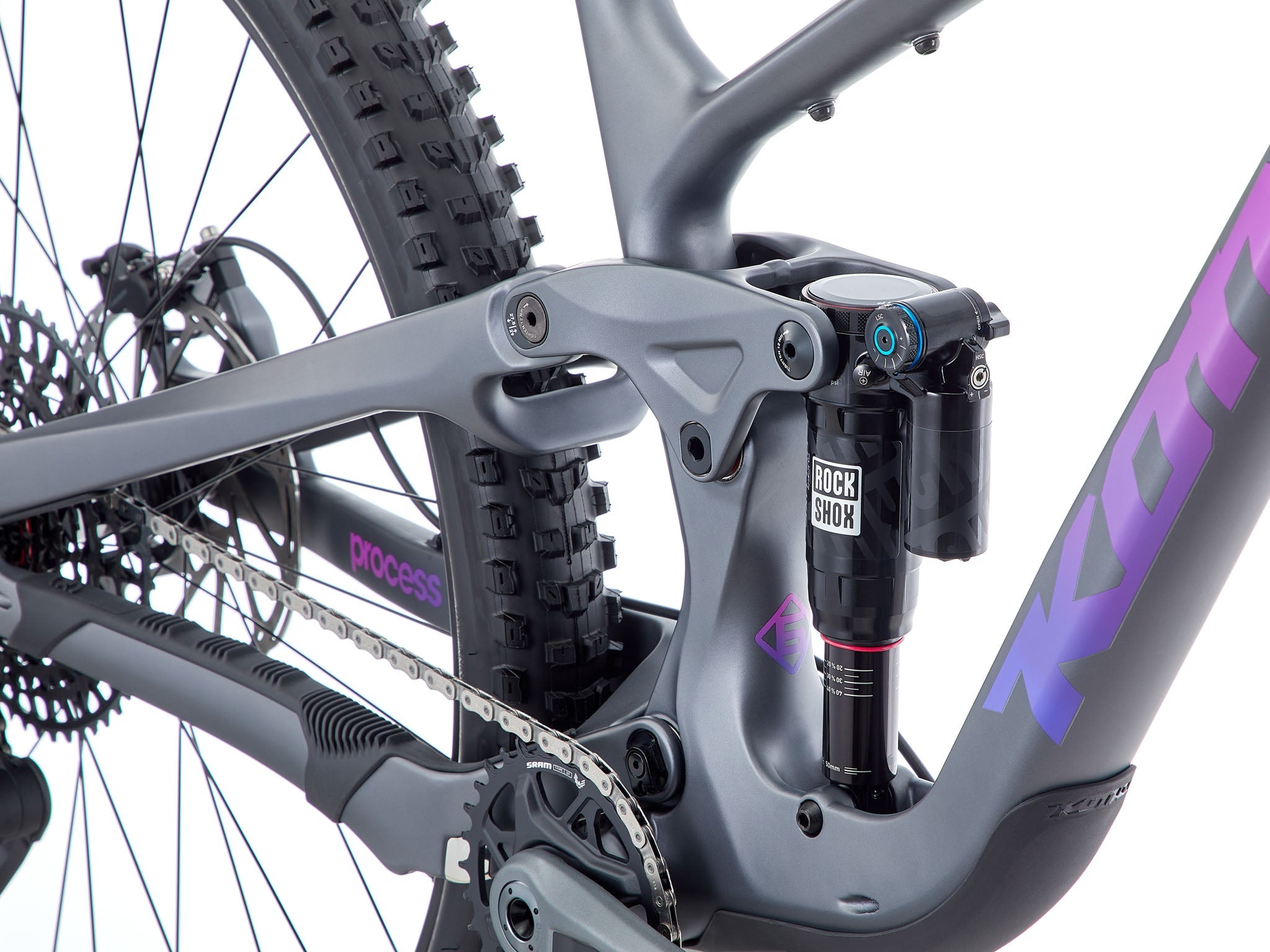 Rider enjoying the TrailMaster 134 Carbon Full Suspension Bike on a downhill path.