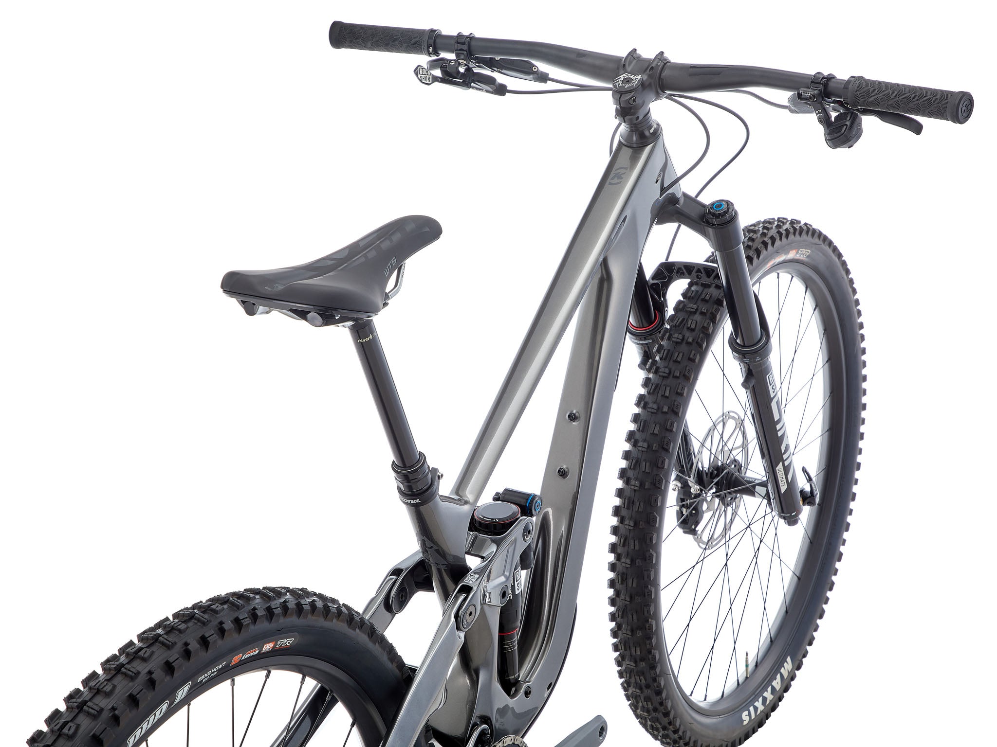 TrailMaster 153 CR/DL full suspension bike on rocky terrain, showcasing its robust design and superior suspension.