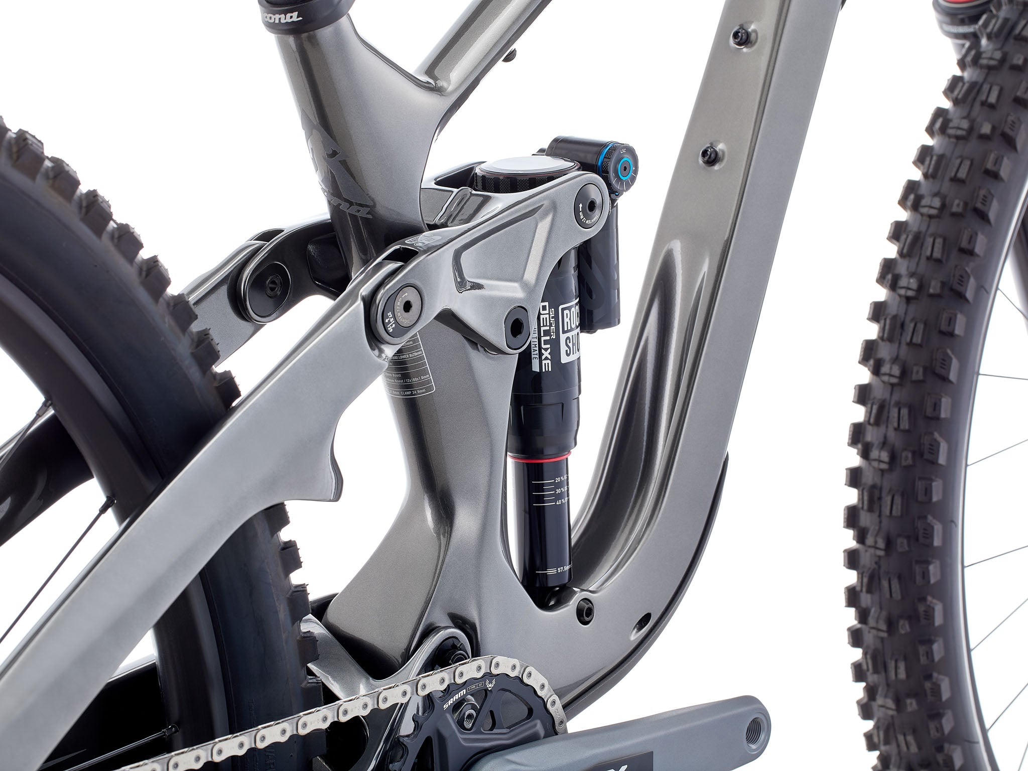 TrailMaster 153 CR/DL full suspension bike on rocky terrain, showcasing its robust design and superior suspension.