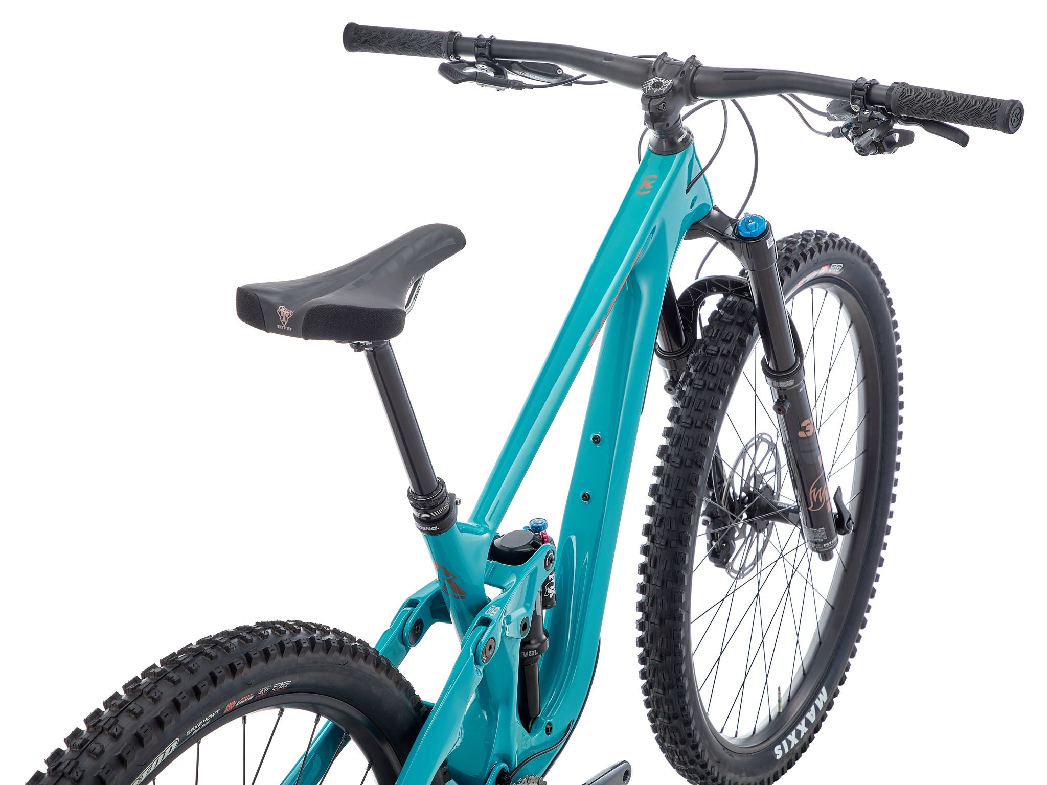 Carbon Fiber Trail Master 153 CR on a rocky trail, showcasing its high performance carbon fiber frame.