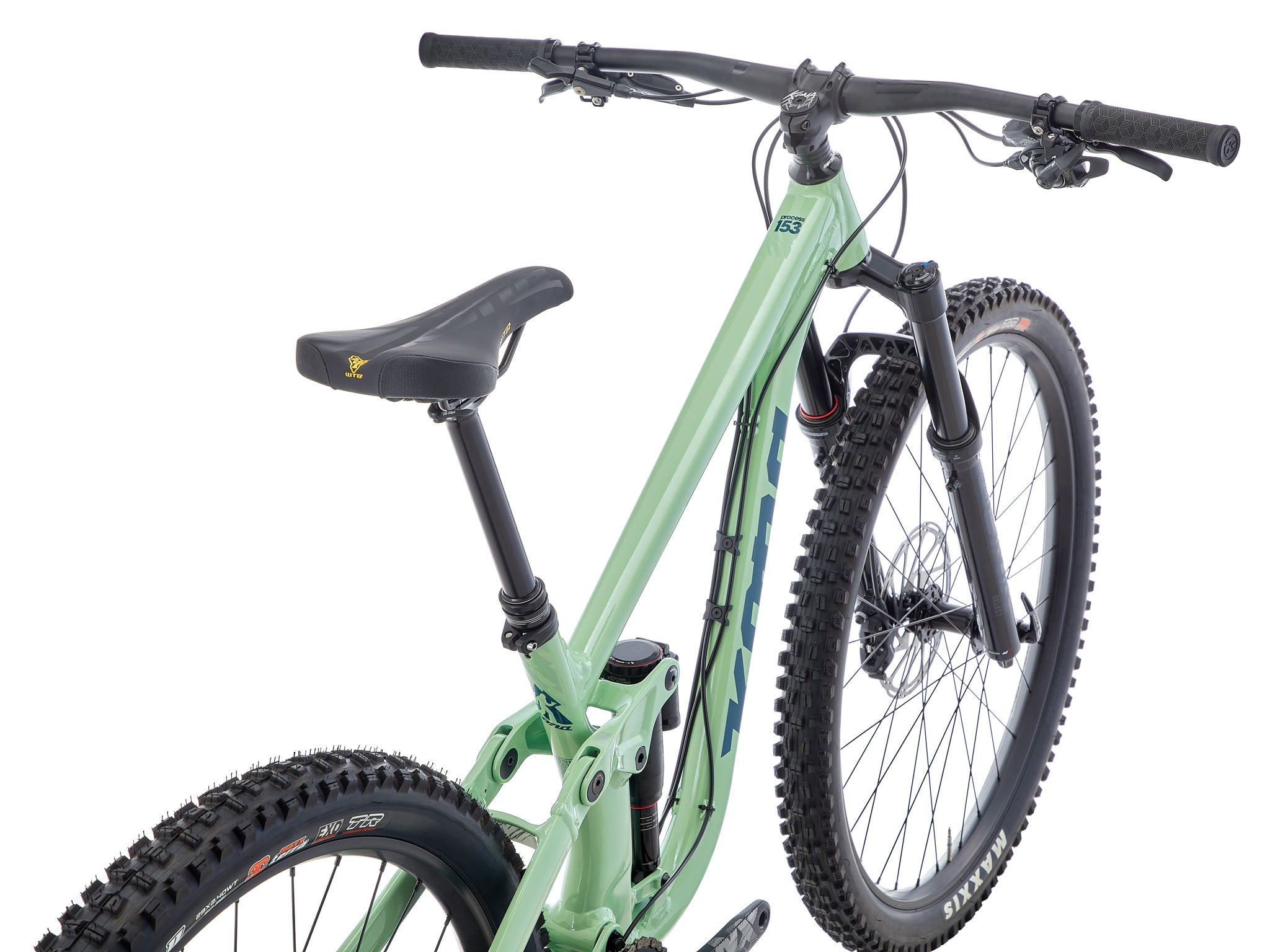 Side view of TrailBlazer Process 153 DL mountain bike on trail terrain