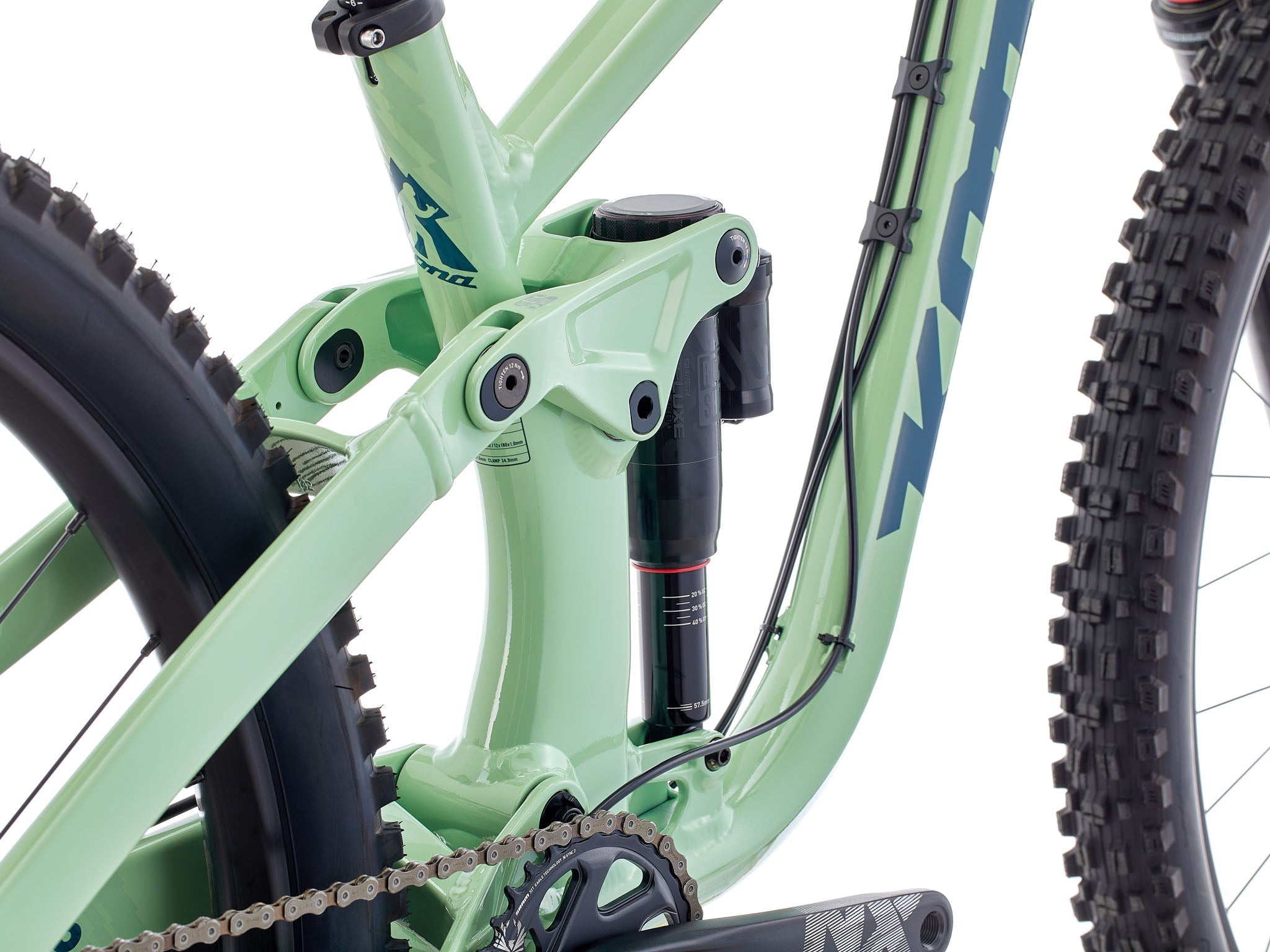Side view of TrailBlazer Process 153 DL mountain bike on trail terrain