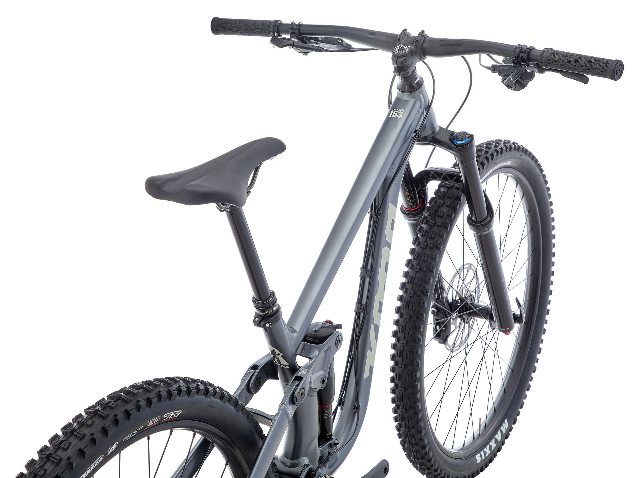 Adventure Buddy 153 mountain bike showcasing its rugged design on a forest trail.