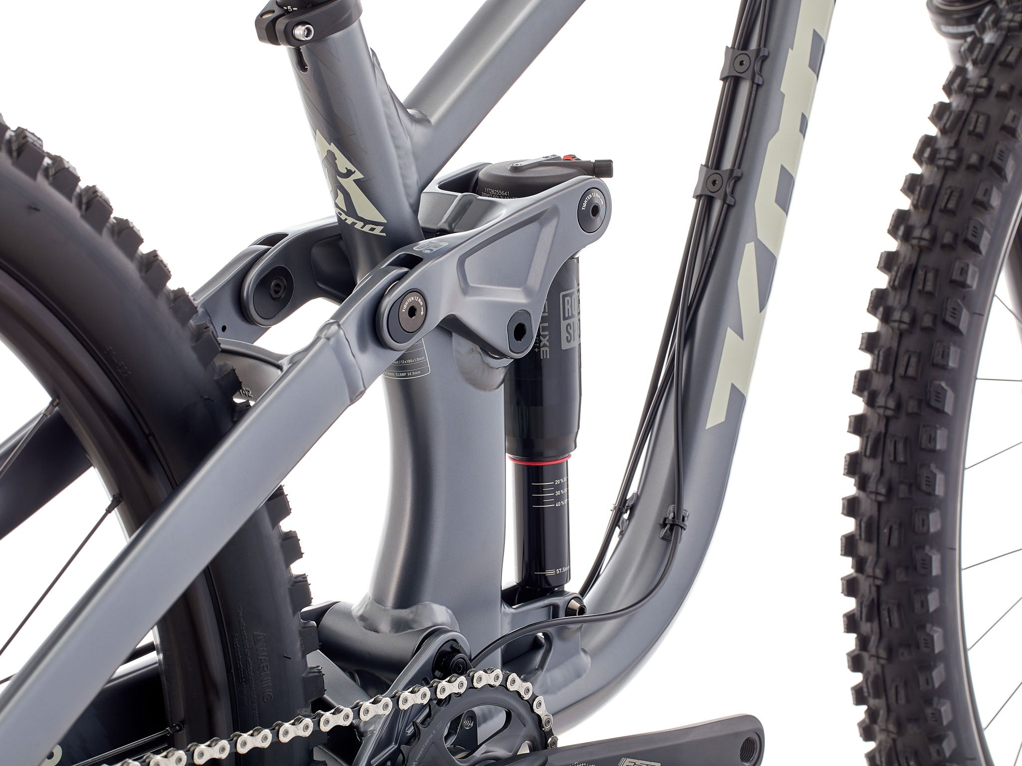 Adventure Buddy 153 mountain bike showcasing its rugged design on a forest trail.