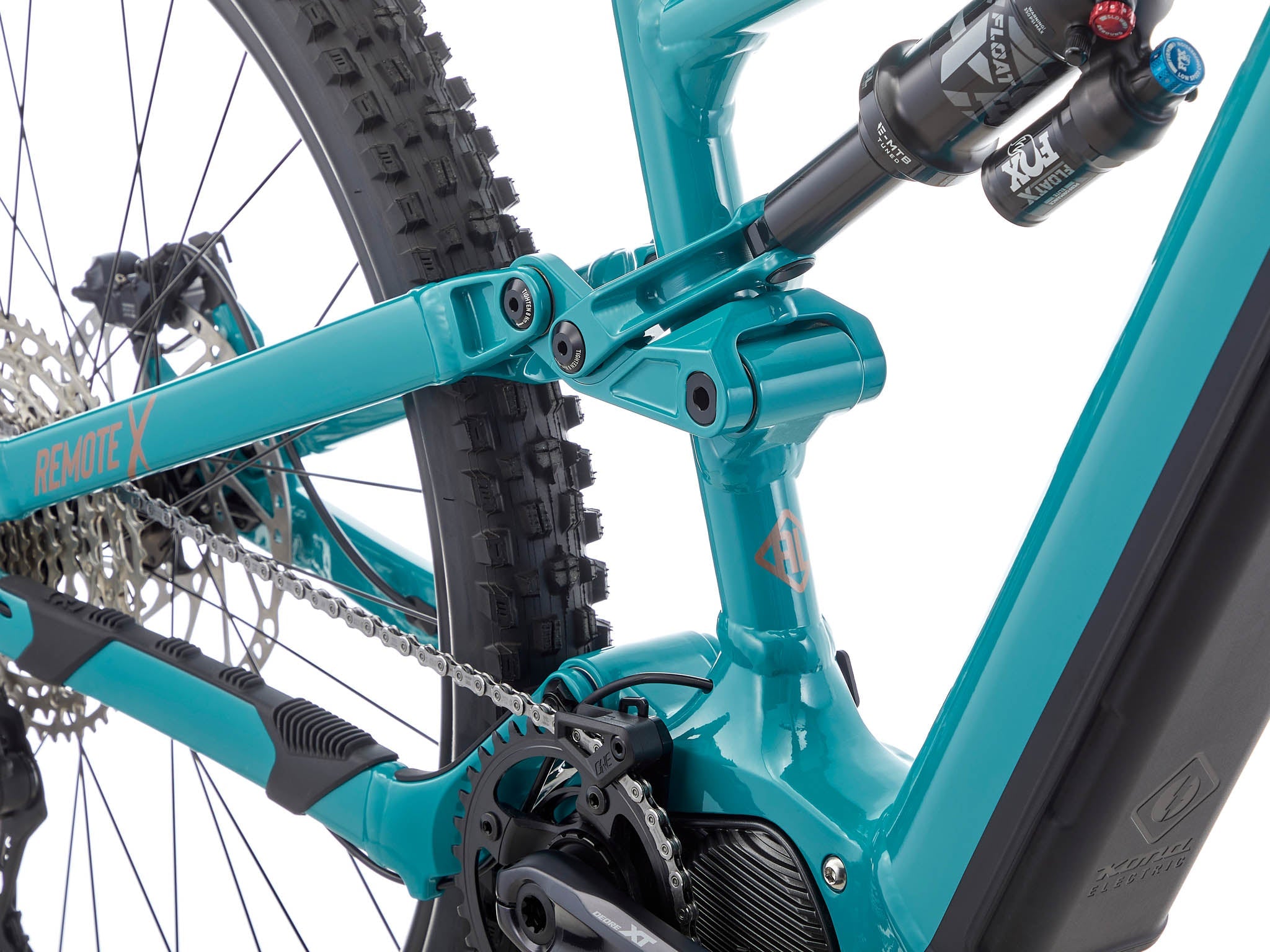 Kona Remote X navigating rocky terrain with rider in action