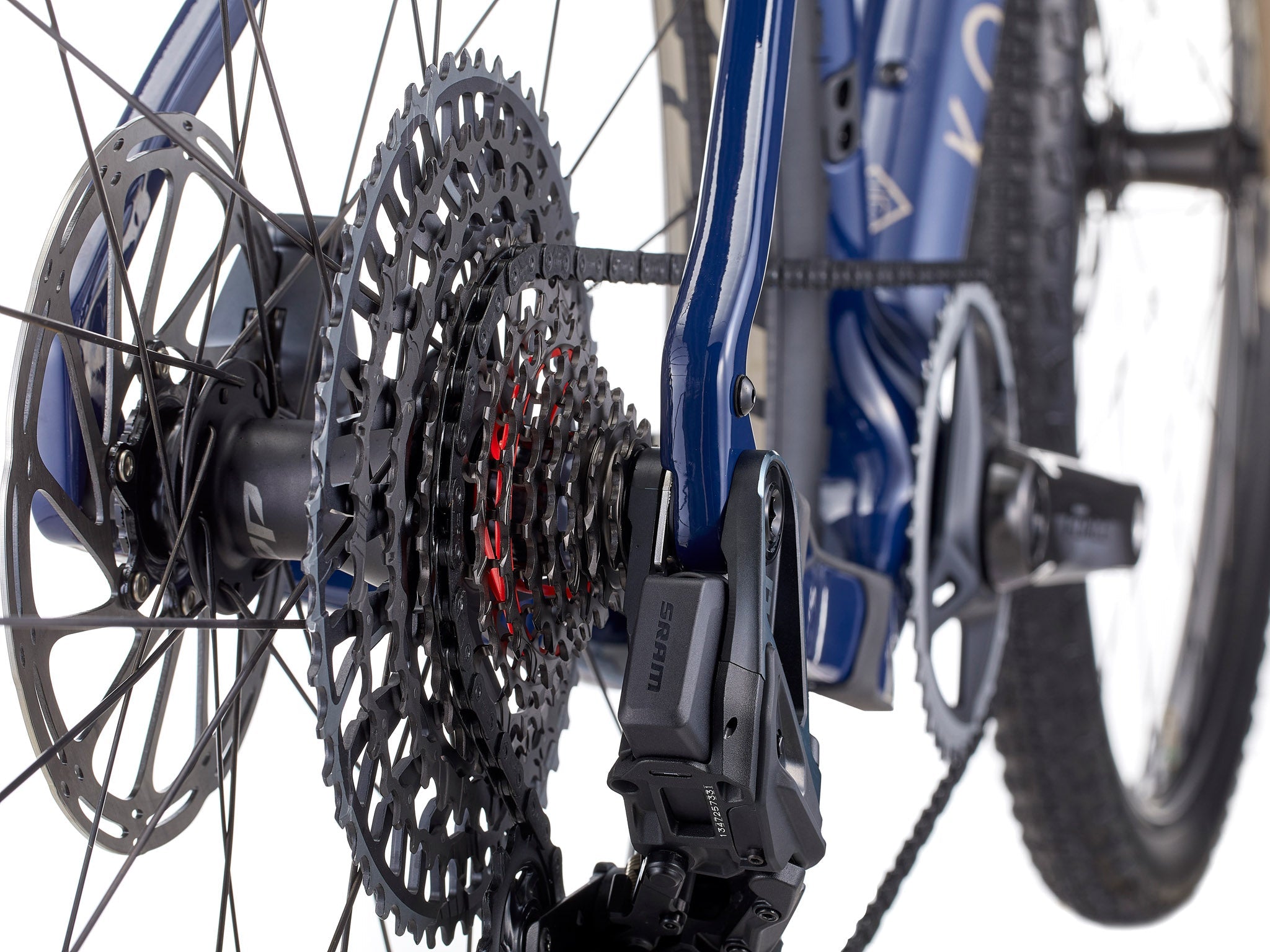 Ouroboros Apex Carbon Mountain Bike parked on a rocky trail, showcasing its carbon wheels.